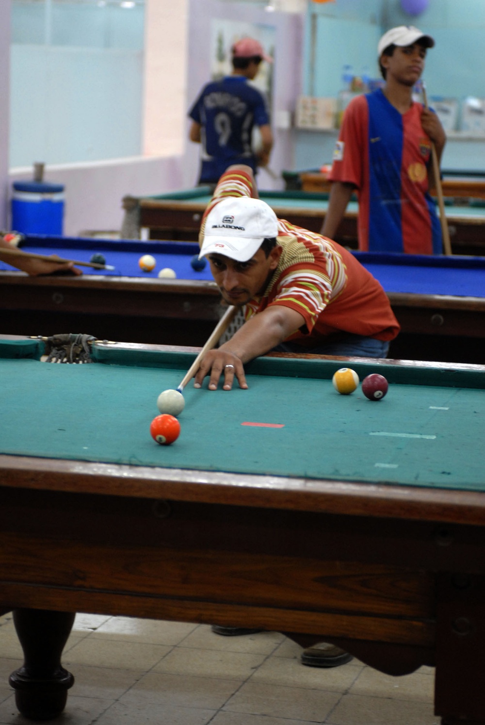 Iraqi Man Enjoys Reopened Community Pool Hall in Northern Baghdad