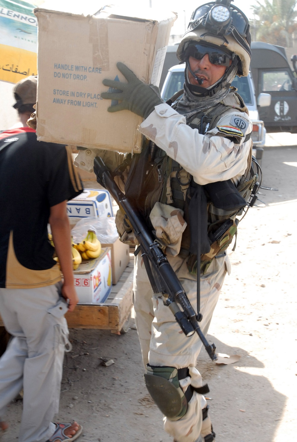 Iraqi Army Soldier Assists in Medical Supplies Delivery to Sadr City Clinic