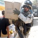 Iraqi Army Soldier Assists in Medical Supplies Delivery to Sadr City Clinic