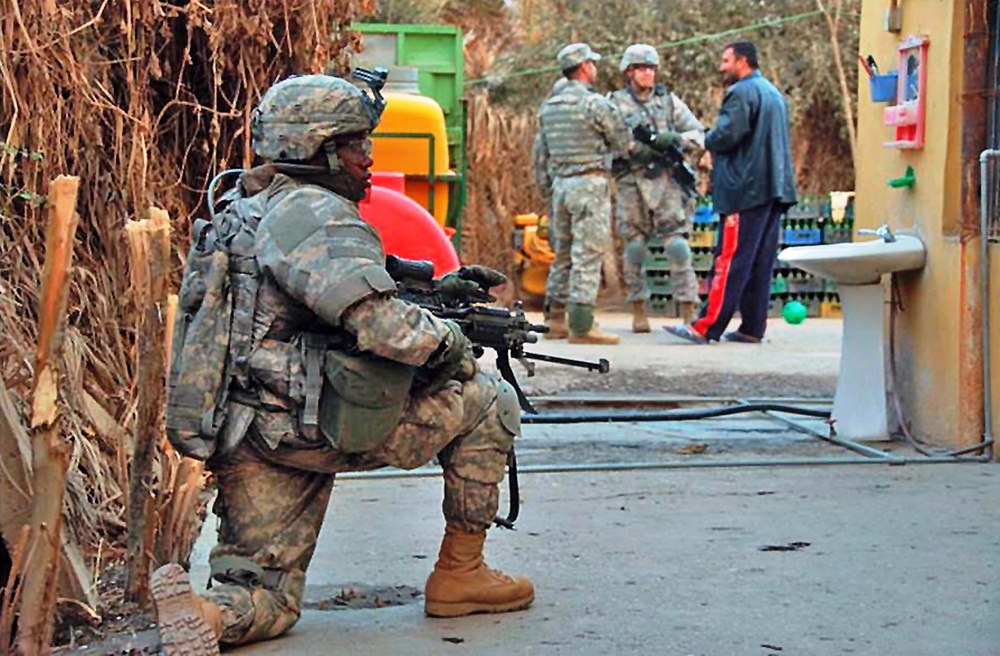 Soldier Provides Security During Baghdad Patrol