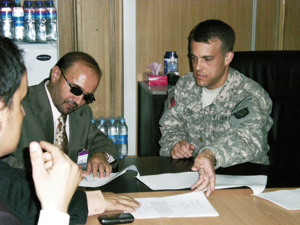 U.S. and Afghan Officials Sign Banking Agreement at Camp Eggers