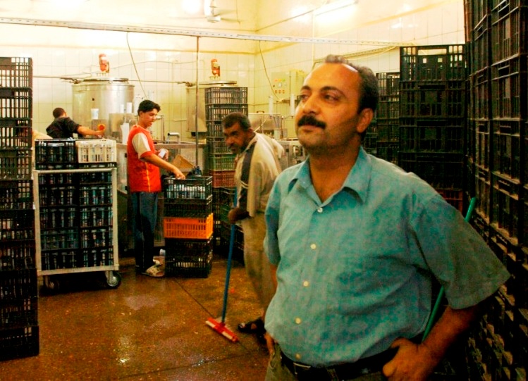Iraqi Dairy Factory Manager Oversees Operations