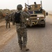 Soldier Guides Humvee to Tactical Position in Iraq