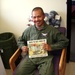 Cambodian Army Captain Reads to Children on Iraqi Base