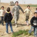 U.S. Army Captain Engages with Iraqi Children on Provincial Farm
