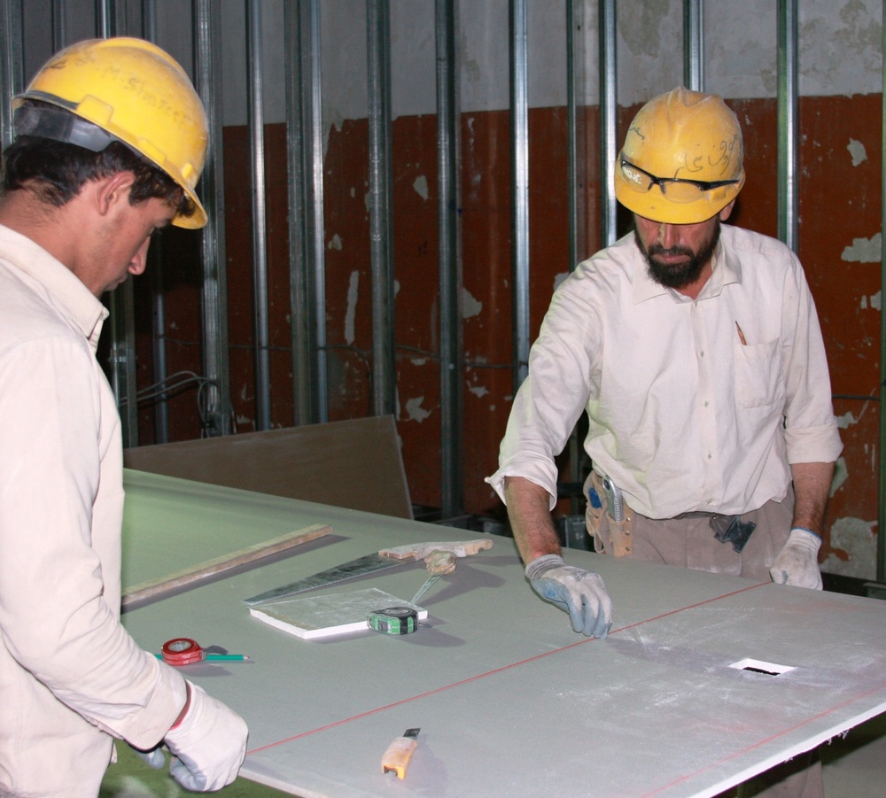 Afghan Workers Prepare Drywall for New $2.7 Million Military Building at Bagram Airfield