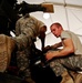 Young Soldier Maintains Apache Helicopters in Iraq