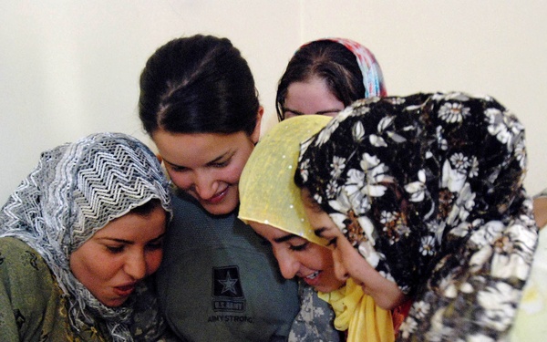 Soldier Shares Photo with Iraqi Household During Operation Summit Pursuit