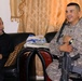 U.S. Soldier Interacts with Iraqi Civilian During Household Assessment