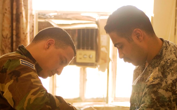 Salvadoran Officer Provides Medical Care to Iraqi Policeman in Kut