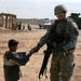 U.S. Soldier Connects with Iraqi Child During Patrol