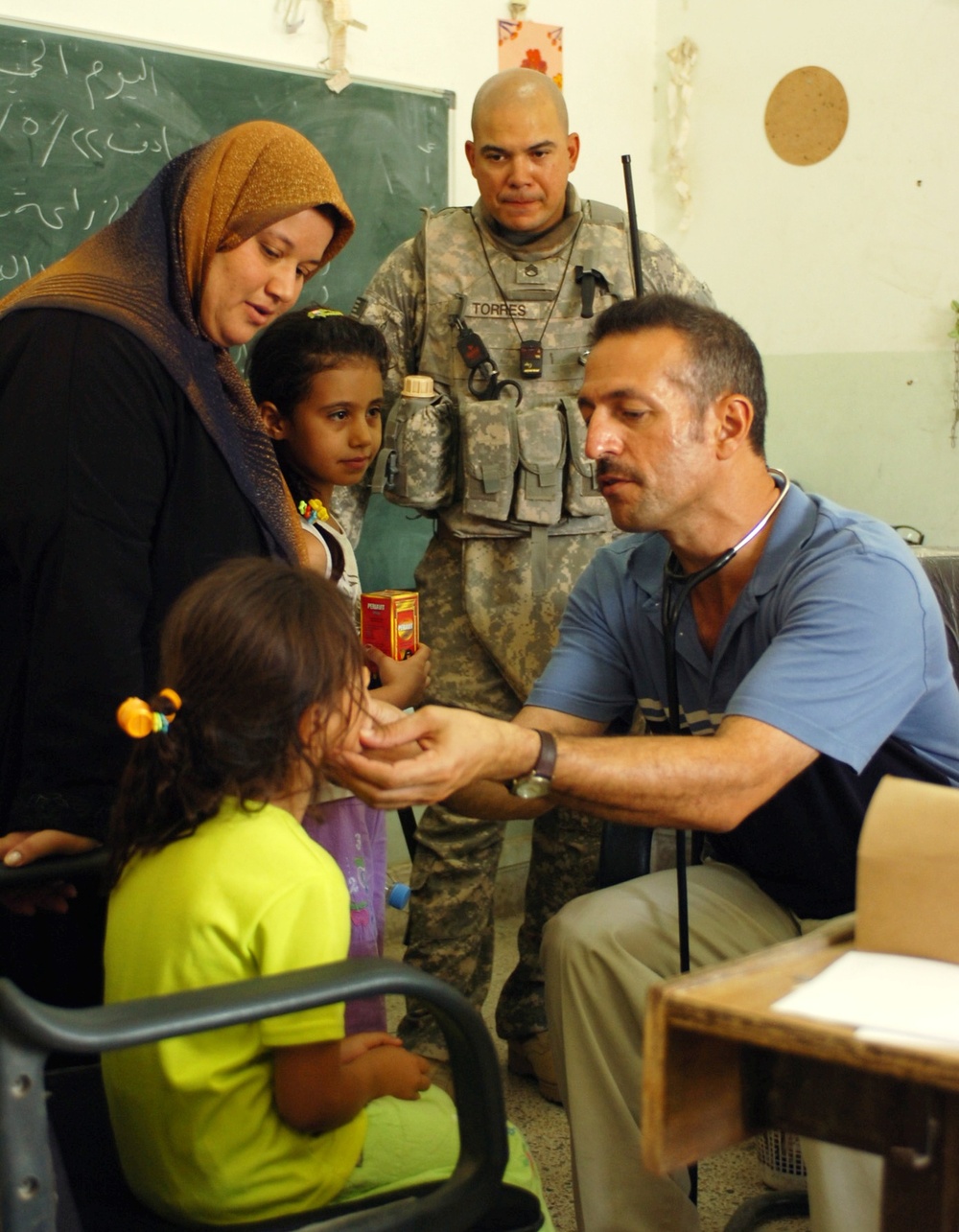 U.S. Soldier Assists Iraqi Girl During Medical Operation in Baghdad