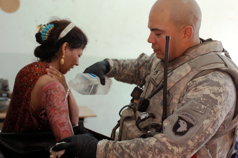 U.S. Soldier Provides Medical Care to Iraqi Woman in Baghdad
