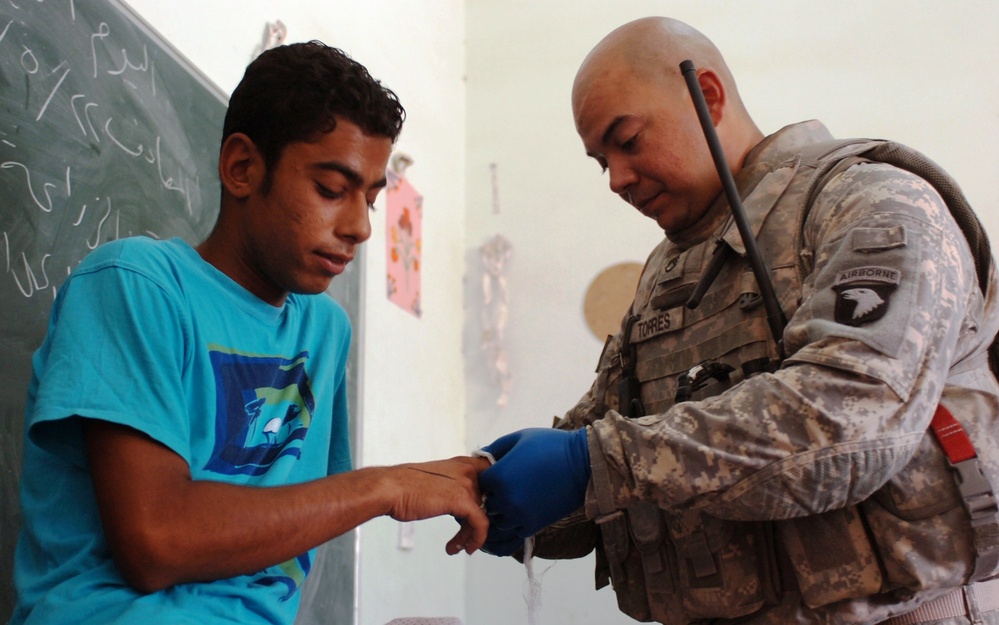 U.S. Soldier Provides Medical Aid to Iraqi Civilian in Baghdad