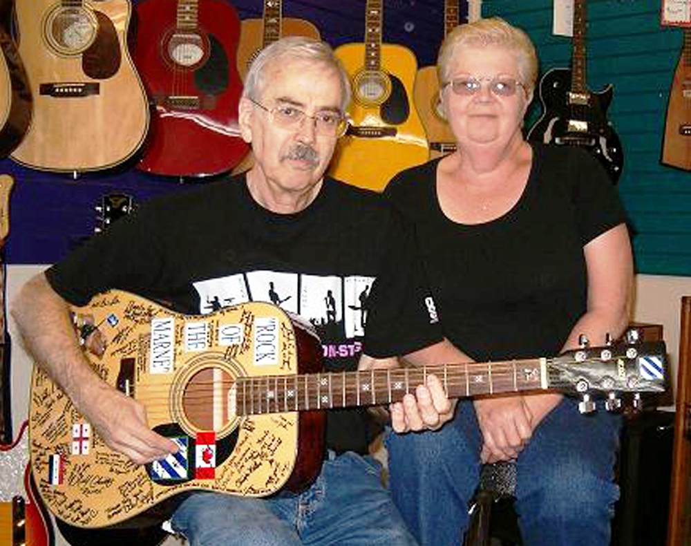 Operation Happy Note Founders Receive Guitar Signed by 3rd Infantry Division