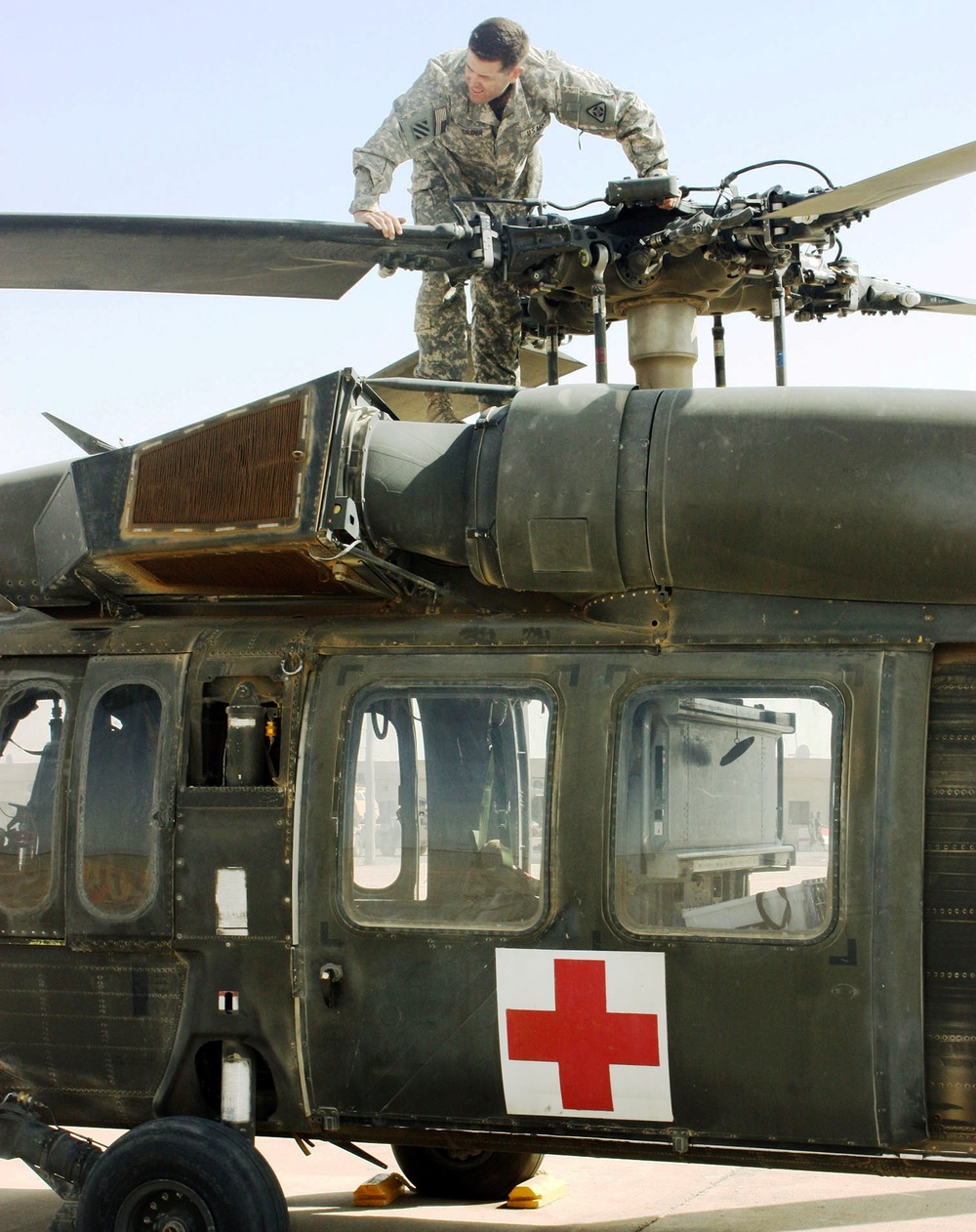 Army Pilot Inspects Black Hawk Helicopter Before Medical Evacuation Mission in Iraq