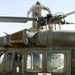 Army Pilot Inspects Black Hawk Helicopter Before Medical Evacuation Mission in Iraq