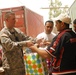 U.S. Soldier Distributes Toys and Clothing to Iraqi Worker