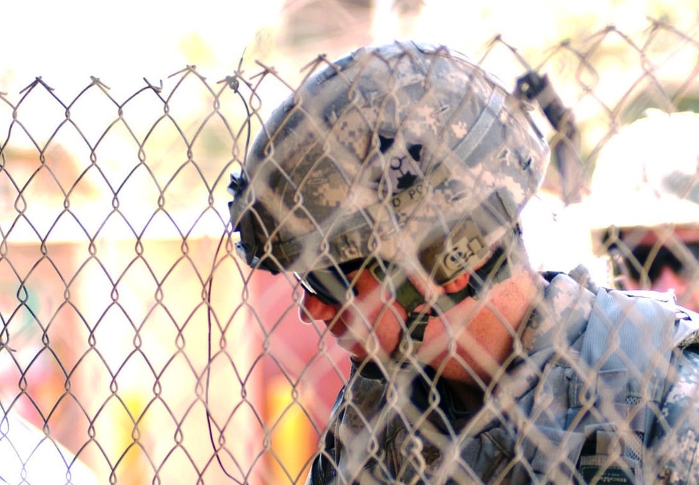 U.S. Army Officer Inspects Broken Generator at Baghdad Fish Market