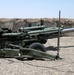 Army Sergeant Poses with Howitzer in Iraq