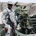 Army Sergeant Poses with Howitzer in Iraq