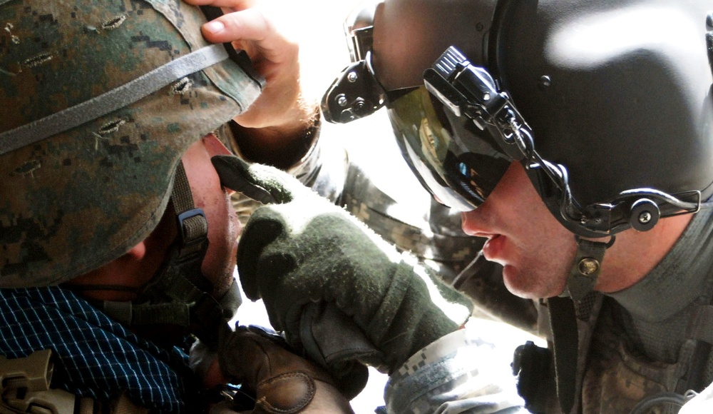 Army Medic Treats Injured Marine During Evacuation Mission in Afghanistan