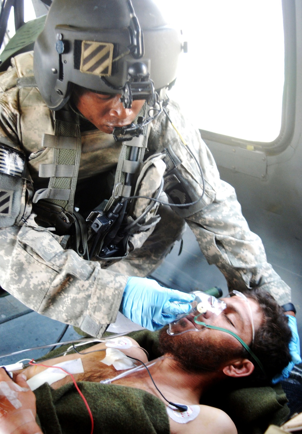 Army Medic Provides Care to Afghan Patient During Transport