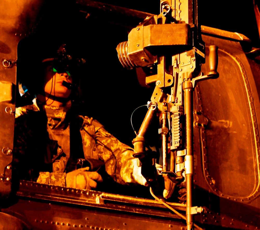 Army Sgt. Mans Gunner's Seat of Black Hawk Helicopter Before Mission in Iraq