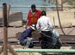 Construction Workers Repair Damage to Grand Canal Bridge in Taji