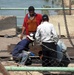 Construction Workers Repair Damage to Grand Canal Bridge in Taji