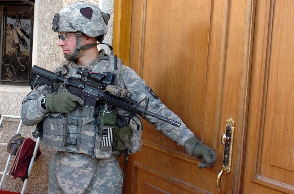 U.S. Soldier Patrols Iraqi Neighborhood