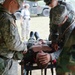 Medical Students Treat Wounded Patient at Battalion Aid Station