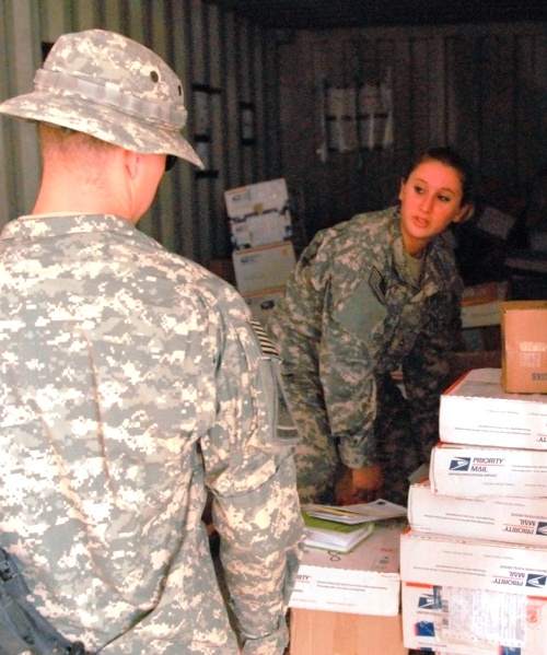 Mail Clerk Sorts Letters for Soldier in Iraq