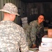 Mail Clerk Sorts Letters for Soldier in Iraq