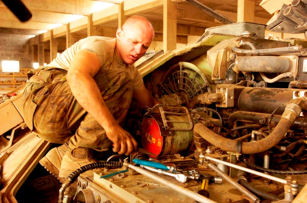 Army Mechanic Repairs Bradley Fighting Vehicle in Iraq