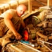 Army Mechanic Repairs Bradley Fighting Vehicle in Iraq
