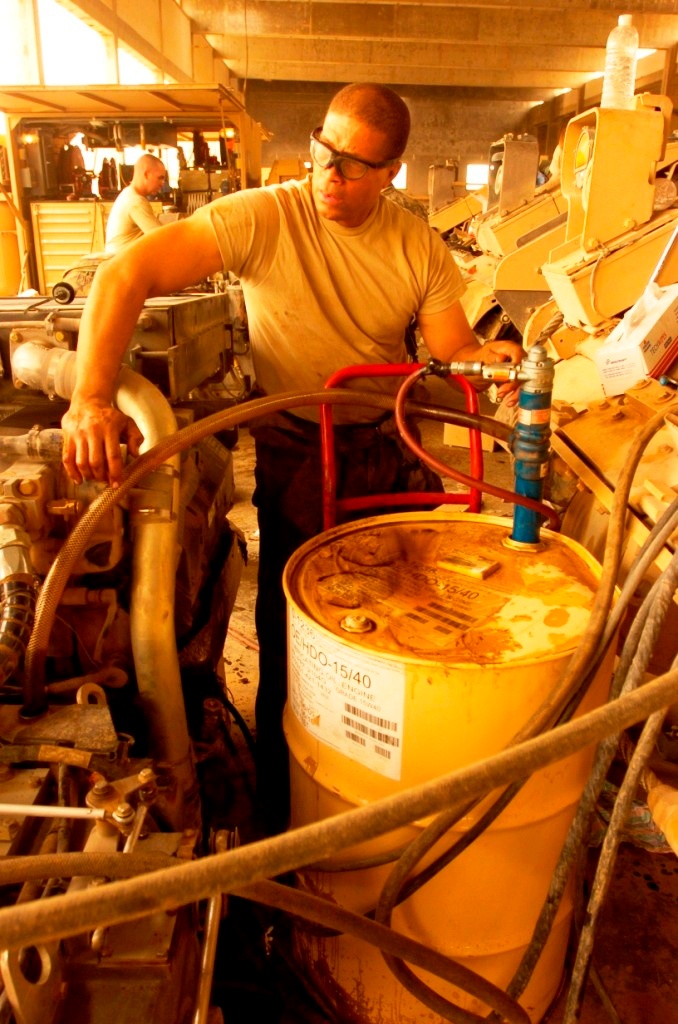 Army Mechanic Performs Routine Maintenance on Bradley Fighting Vehicle in Iraq