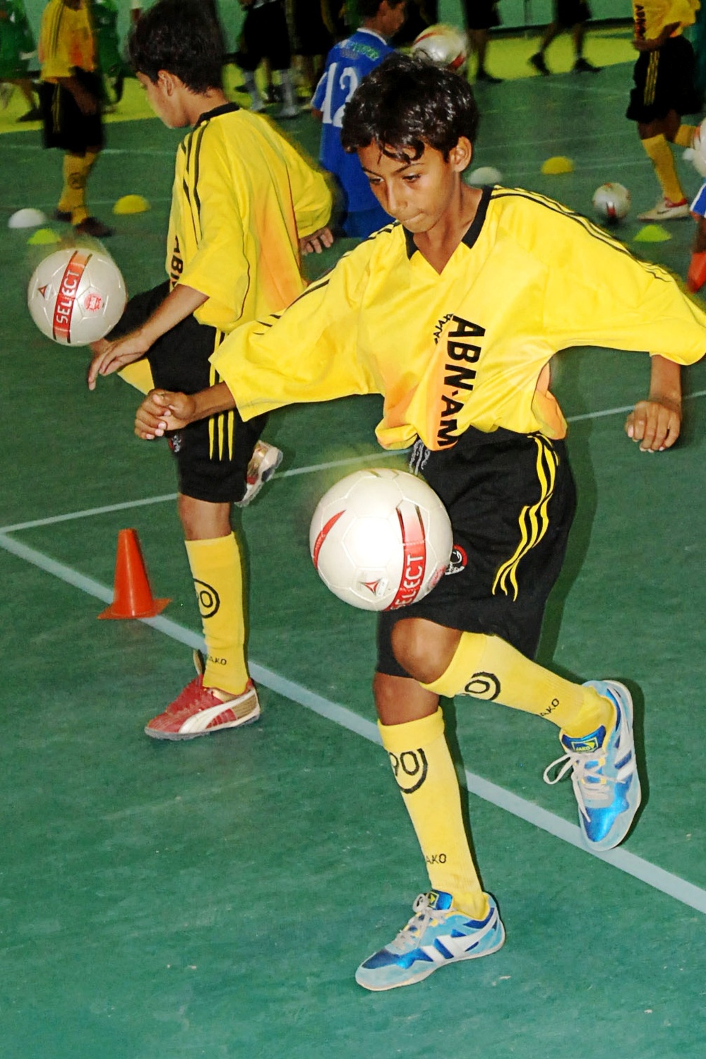 Iraqi Child Practices Soccer Drills at Reopened Karkh Club Gym in Baghdad