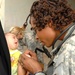 U.S. Army Medic Provides Care to Iraqi Girl During Medical Engagement