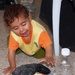 Iraqi Child Waits for Mother's Medical Exam During Cooperative Engagement