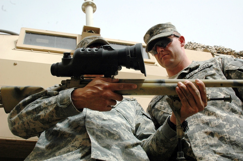Army Snipers Inventory Weapons at Forward Operating Base in Iraq