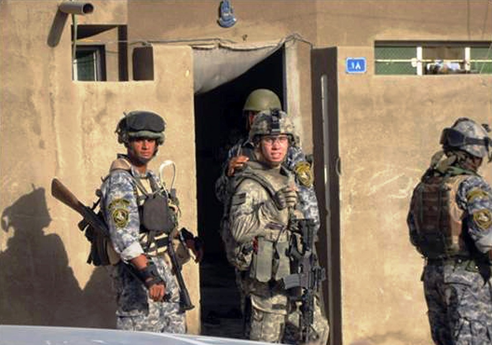 U.S. Soldier Assists Iraqi Police in Baghdad Clearance Mission