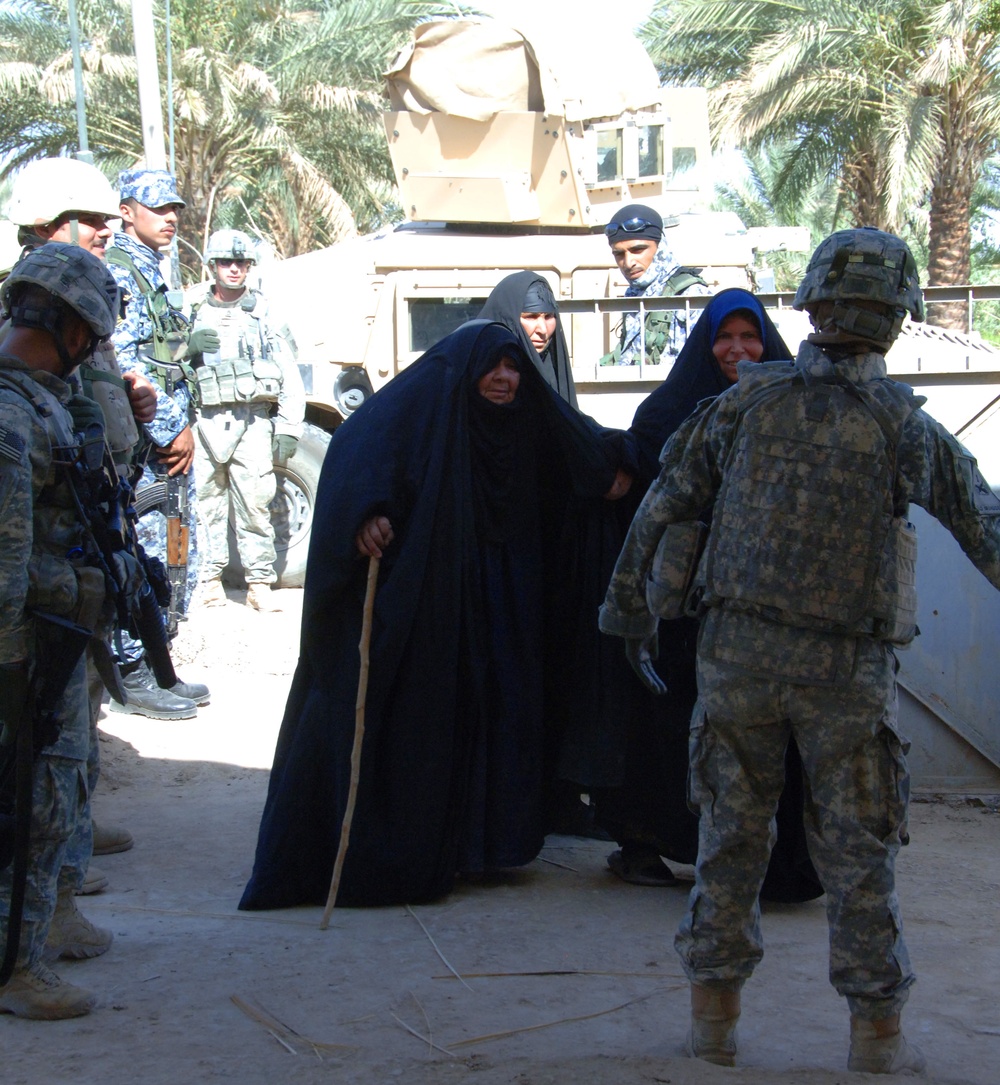 Soldiers Provide Medical Care and Aid to Iraqi Residents