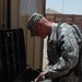 Texas Soldier Maintains Weapons at Camp Liberty in Iraq