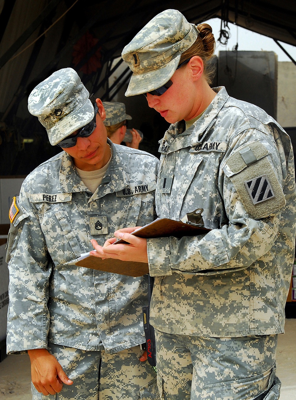 Army Officer Conducts Inventory Ahead of Combat Patrol in Iraq