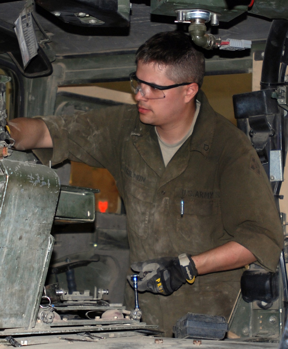 Army Mechanic Maintains Vehicles in Iraq