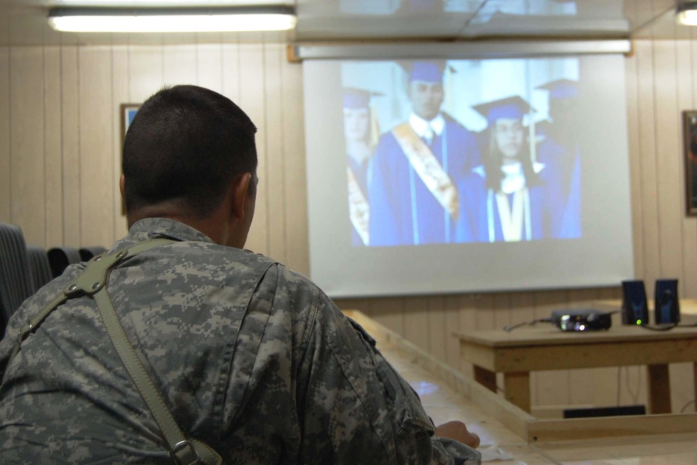 Army Sergeant Watches Daughter Graduate from Iraq