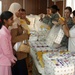 Soldiers and Advisor Provide Aid to Waiting Mothers in Iraq