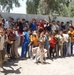 Iraqi, U.S. Troops Distribute Aid to Eager Children in Dehna Village