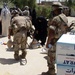 Iraqi, U.S. Troops Distribute Aid to Village West of Baghdad